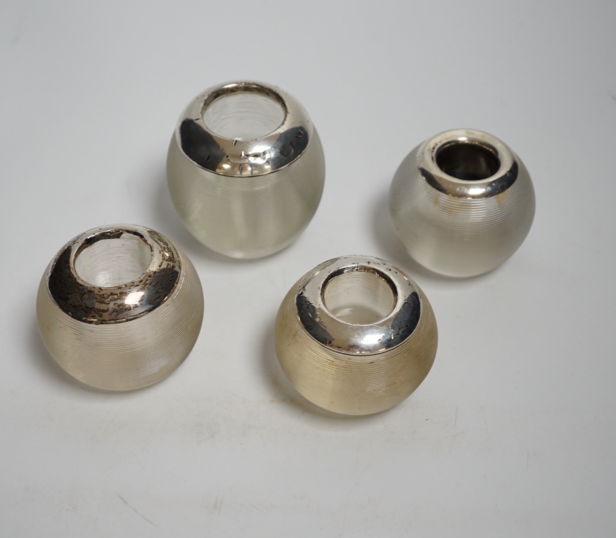 Four assorted silver match glass match strikes, tallest 76mm, marks rubbed.
